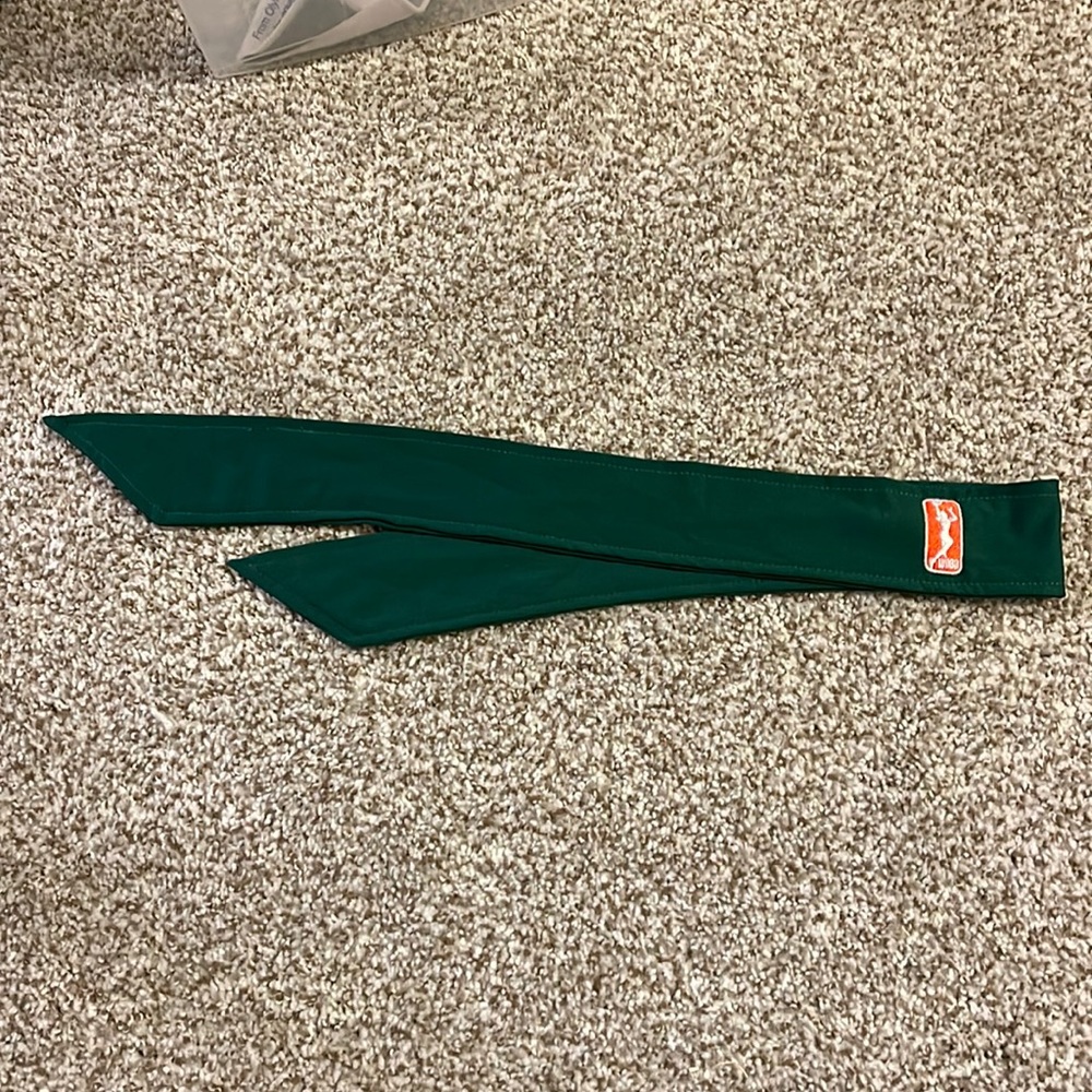 WNBA logo - Adidas green headband, for basketball.